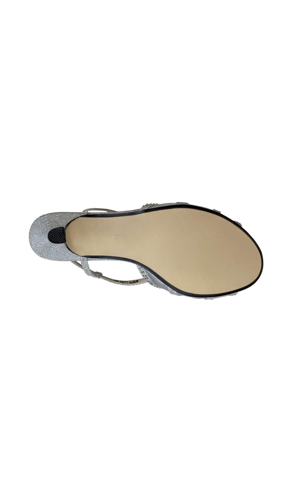 A top-down view of the Clara Silver Low Heel Prom Shoes 4486, featuring a smooth beige sole, small textured grip near the heel, and a comfortable 1.75-inch heel—ideal for special occasions.